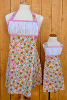 
              Ruched Floral and Pink Apron - Adult
            